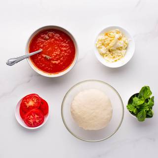 You can see the pizza dough and tomato sauce recipe in the link to the ingredients section