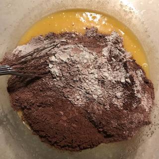 Sift the dry ingredients (flour, salt, baking powder, cocoa powder) and then add to the mixture.