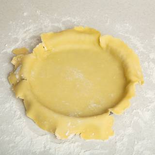 Take the dough slowly with your rolling pin and carefully place it on your pie tin, then slowly push the dough inside the tin. (try to avoid tearing your dough).