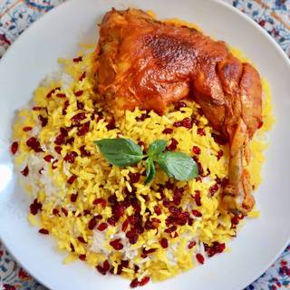 Gently spoon about 1 cup cooked rice from pot and arrange on a platter. Scatter 2 tablespoon berries and a quarter of Saffron Chicken on top OR Serve it Persian style, so that spoon in rice to big platter and design it with barberries mixture, on a separate plate serve chicken with its sauce.