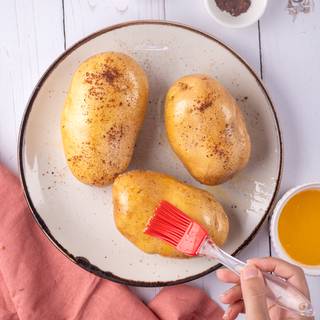 cover the potatoes with butter, salt, and pepper. 