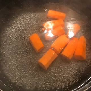 Now add the prepared vegetables into the boiling water. You need to add firm vegetables that need more time to cook first, so I added the carrots first.