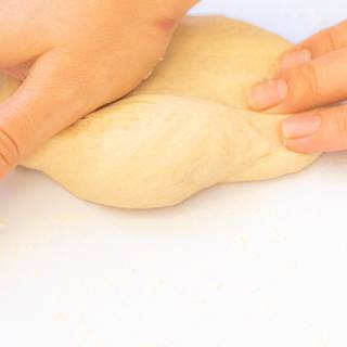 Then transfer to a surface and knead the dough for at least 10 minutes. ⁣ Wherever you feel the dough is too sticky, you can add a little flour. Just be careful not to add too much flour. By Kneading the dough's sticky gradually decreases. ⁣ Then fold the dough 7-8 times.