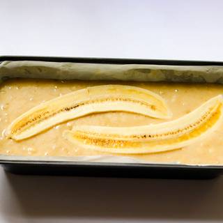 Fill the pan with the mixture and cut half of a banana from the middle and put it on the cake's mixture, if you like.