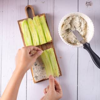 Place the cucumbers on the cheese and pot another slice of bread on the top.