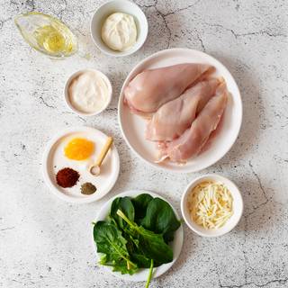 Use a sharp knife to cut a pocket into the side of each chicken breast side and season them with salt and pepper.