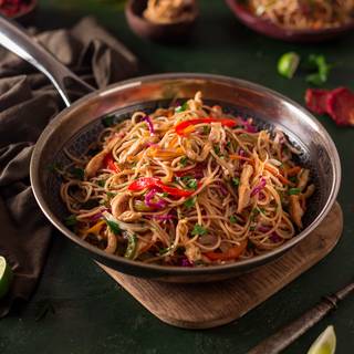 Take the chicken chow mein off the heat and serve it immediately.