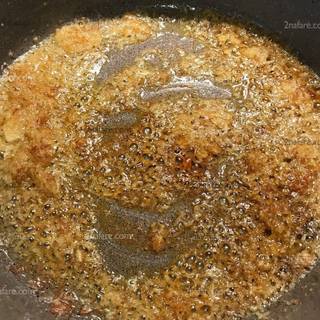 Chop the onion and fry it well. Then add turmeric and pepper.