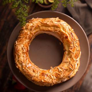 Cut the Paris Brest in half and pipe the caramel whipped cream filling inside it with your favorite tip.