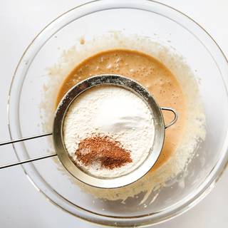 Sift flour, baking powder, baking soda, vanilla, and cinnamon in the batter.