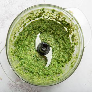 Turn on the food processor and mix all the ingredients well until they are combined. Your sauce should have a soft texture and be light green.