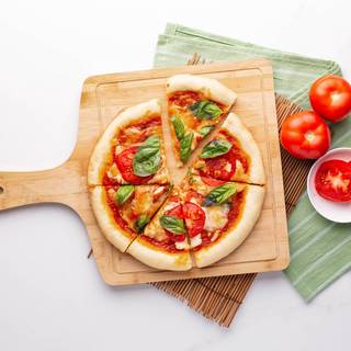 Finally, pour the fresh basil over the pizza and enjoy. 