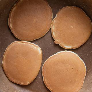 When bubbles come up on the pancake's surface, it means they are ready, and you can serve them. When you heat your pancake without any oil, you reach a smooth and delightful appearance which is highly tempting. You can see it in this picture.