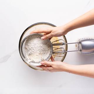 sieve flour and baking powder and add them to the batter.