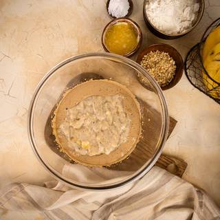 Add mashed bananas to the batter and whisk slowly.