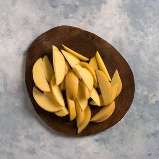 Wash the potatoes and slice them the same as in the picture. The slices shouldn't be too thin.