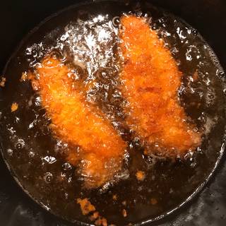 Fry the chicken over low heat until they cook on the inside and get golden on the outside for about 10 minutes.