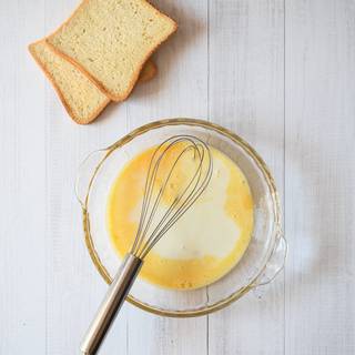 Add milk to the eggs and whisk them well.