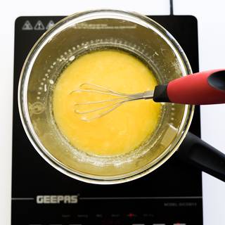 Mix the melting butter with sugar. Stir until the sugar melts too.