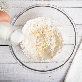 Then, pouring milk slowly until all the ingredients mix softly together.