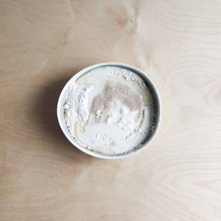 When the yeast started to bubble up, pour flour into a bowl and add yeast, yogurt, olive oil, and milk to it. 