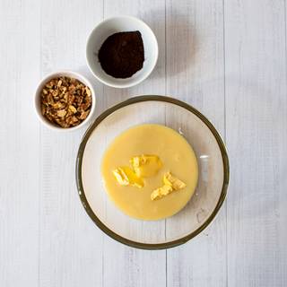 Mix room temperature butter with condensed milk and stir.