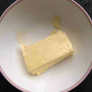 Place room temperature butter in a large bowl.