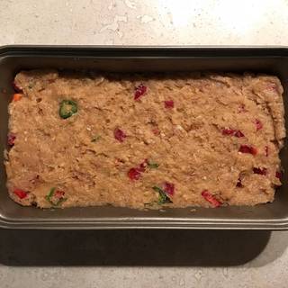 Place the mixture in a lightly greased loaf pan.