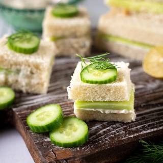 You can cut your sandwiches in half or to four pieces and serve them as finger food. Finally, decorate with cucumber slices.