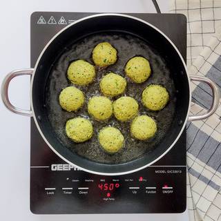 pour enough oil in a pan and wait until it's hot, then fry the falafels in the pan.