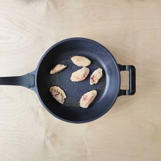 Heat the oil in the pan and fry each side of the dumplings for 2 minutes.