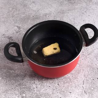 Mix the water, sugar, salt butter in a pot on medium heat until they dissolve and the water comes to a boil. 