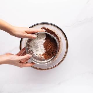 Sift flour and cocoa powder and add them to your batter. add salt and vanilla in the end and whisk until everything is combined well.