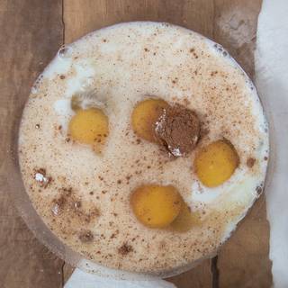 Mix the egg, milk, vanilla, cinnamon, nutmeg, and salt in a bowl.