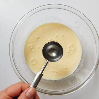 Add the vinegar to the batter and whisk well. when you add the vinegar, the milk will curdle and separates into curds and lumps.