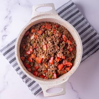 Now, add the rest of the ingredients, salt, and pepper, and mix them. Cover the lid and lid them cook for 30 minutes on low heat. Take off the lid for the last 5 minutes. 