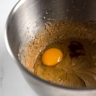 Add the egg and vanilla extract and mix them for one minute.