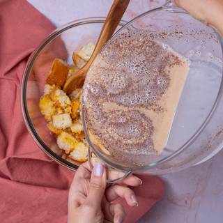 Add bread to the bowl and soak up with egg mixture.