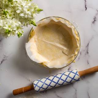 Put the dough inside the fridge for 20 minutes or 5 minutes in the freezer. Cover the dough with some parchment paper.