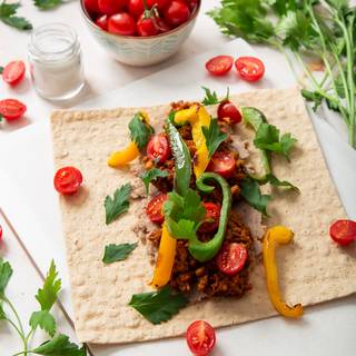 Add fried sweet pepper to your fillings. You can use them in different colors. Add some fresh parsley to make your burrito smell better.