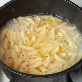 Fill a large saucepan with water, season with salt, and bring it to a rolling boil. Cook pasta for 8-10 minutes.