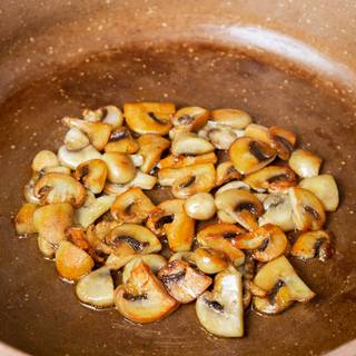 Add oil to the pan and heat it, fry the mushrooms to get brown.