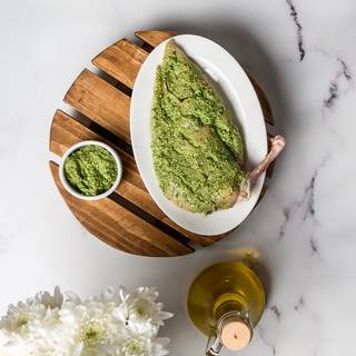 Cover all of your chicken with pesto sauce and keep them in the fridge in a lidded dish for half an hour so the chicken absorbs the sauce well.