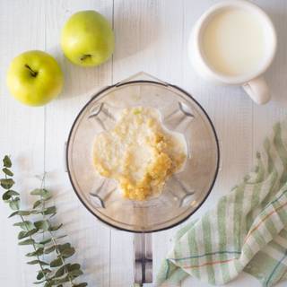 Add the milk to your blender and mix it with the apples until they are completely combined and the apples are mashed as well.