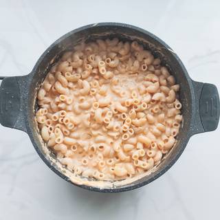 Add the cooked pasta to the sauce and mix them well. Taste it a little to make sure you've used enough salt.