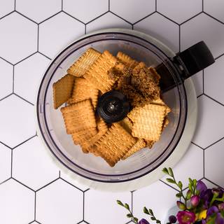 Pop your cookies into a food processer with some brown sugar, pop on your lid, and pulse them until they are really nice and fine with no lumps.