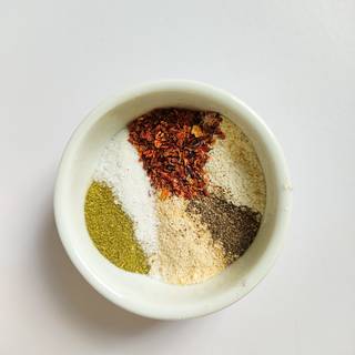 Measure the spices and put them all in a bowl and mix.