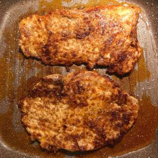 Flip the chicken to cook both sides.