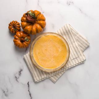 In another bowl, mix all our wet ingredients, which include: egg, milk, pumpkin puree, cinnamon, oil, fresh sour lemon juice, and lemon zest with a hand mixer well.