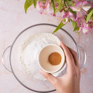 Mix flour, sugar, baking powder, salt, and cinnamon in a bowl.